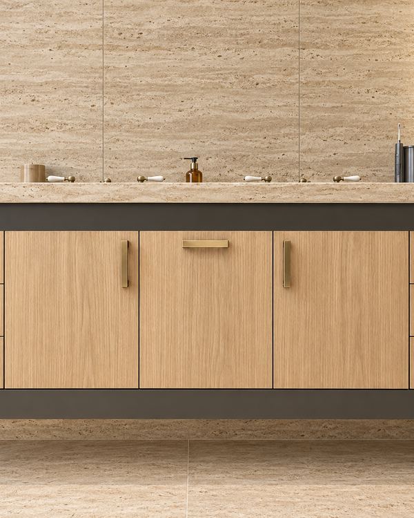 Floating vanity design shown in white oak with a dark band, against a travertine wall